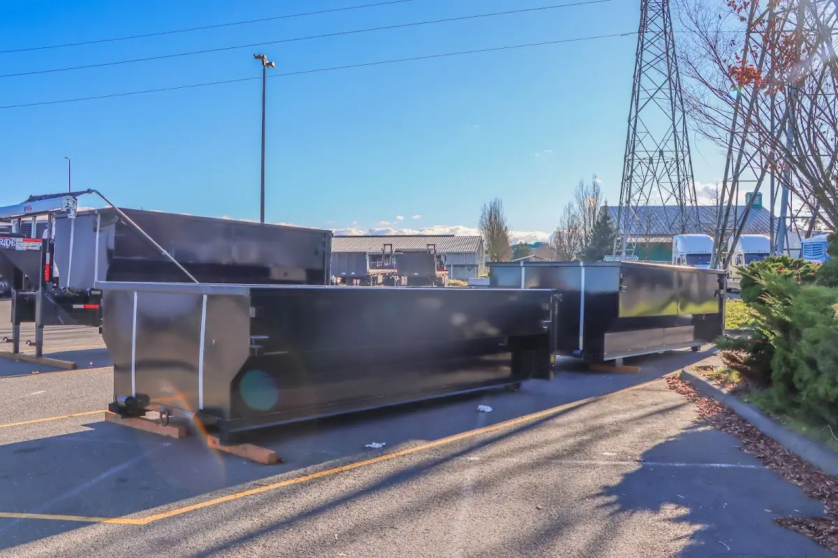 Roll-off dumpster ready for waste disposal at job site for Yard Waste Dumpster Rental in Battle Ground